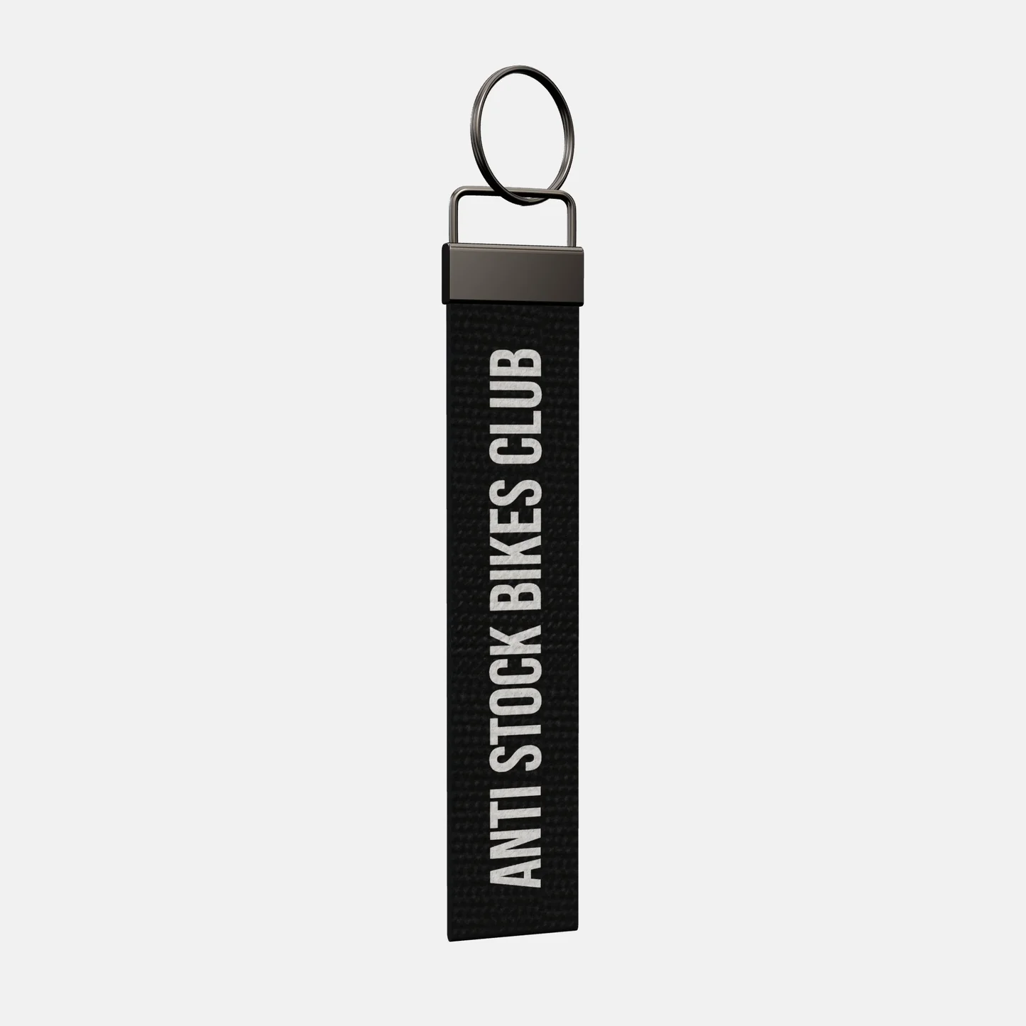 ANTI STOCK BIKES CLUB Keychain at an angle, black-nickel clamp and split ring