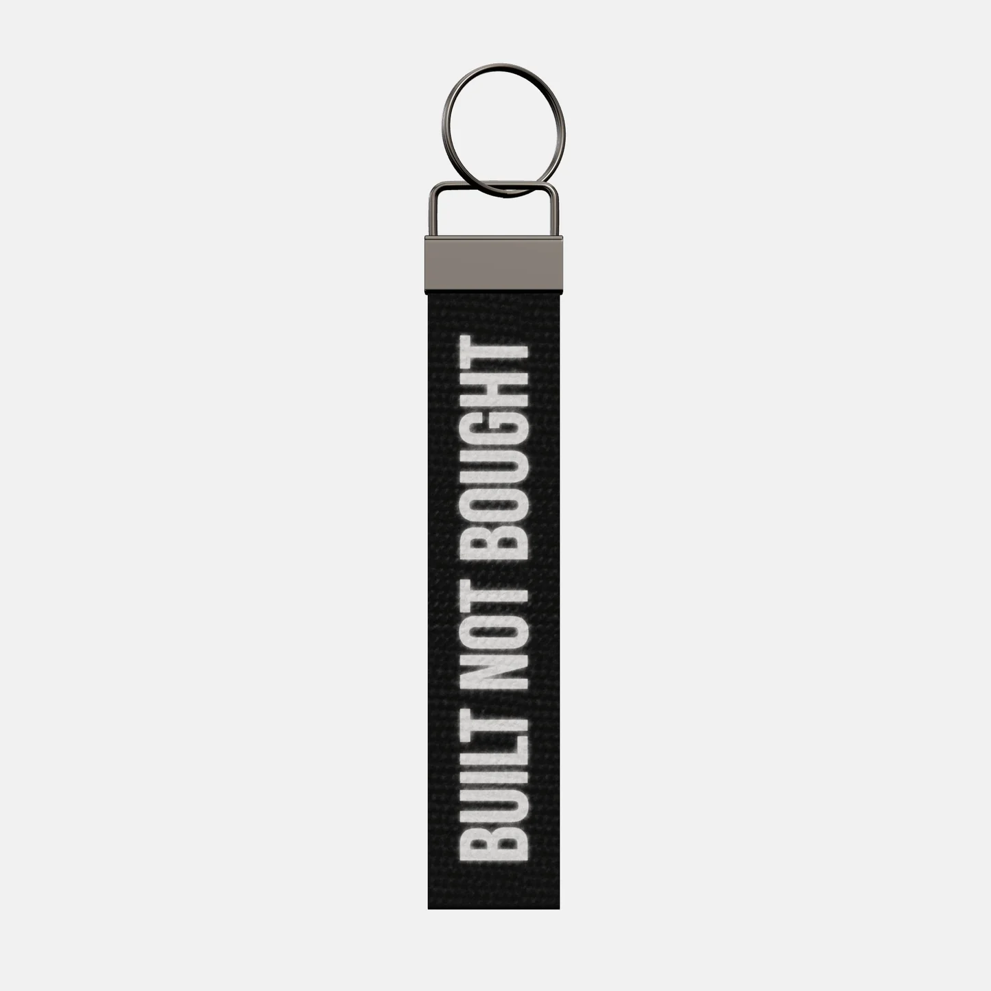 BUILT NOT BOUGHT Keychain, front: BUILT NOT BOUGHT in reflective print