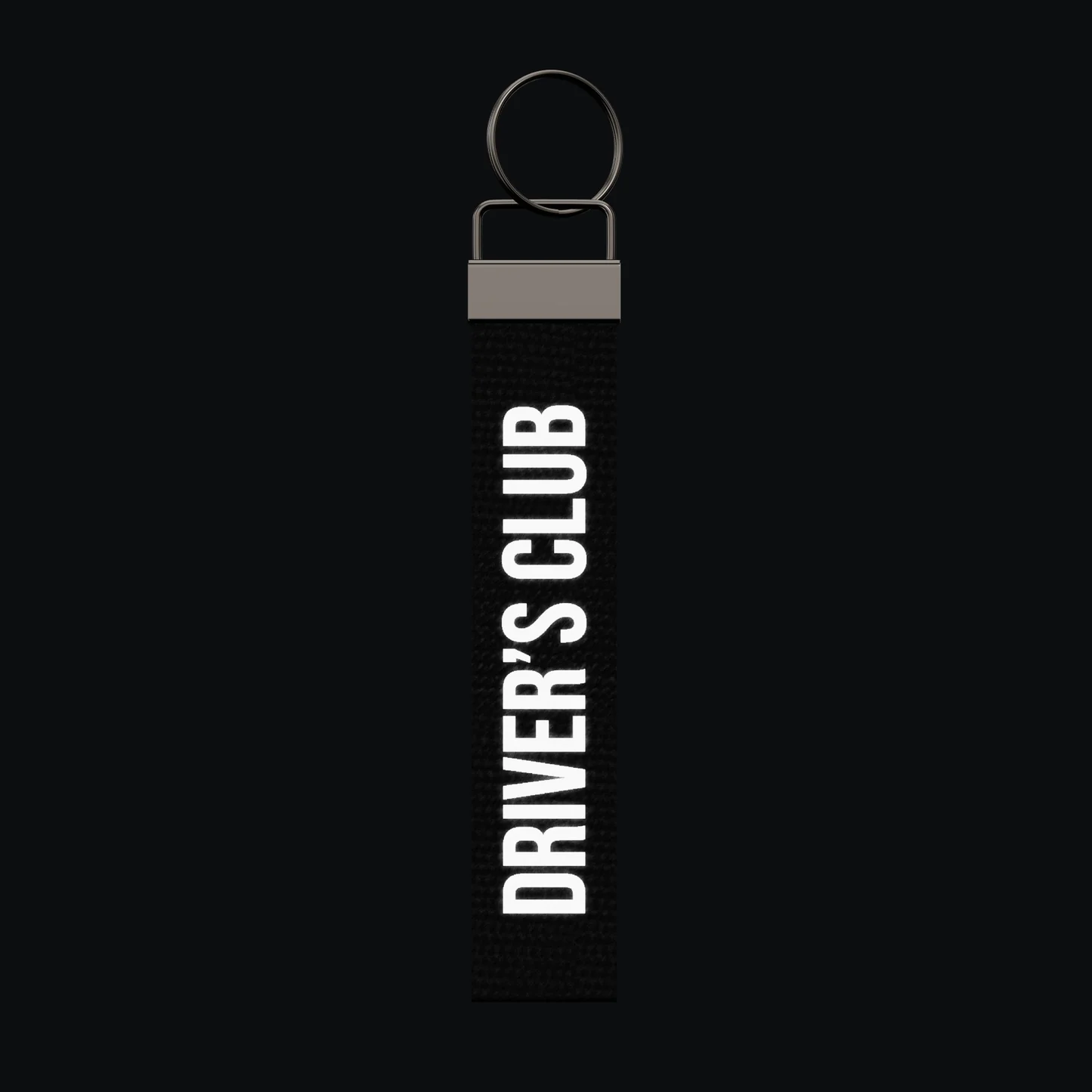 DRIVER’S CLUB Keychain, reflective print lit up by a camera flash