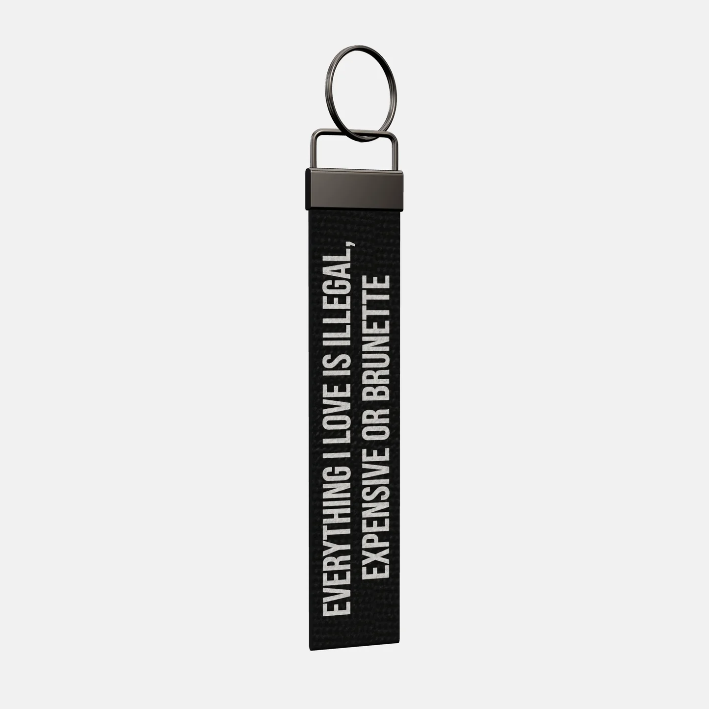 EVERYTHING I LOVE IS ILLEGAL, EXPENSIVE OR BRUNETTE Keychain at an angle, black-nickel clamp and split ring