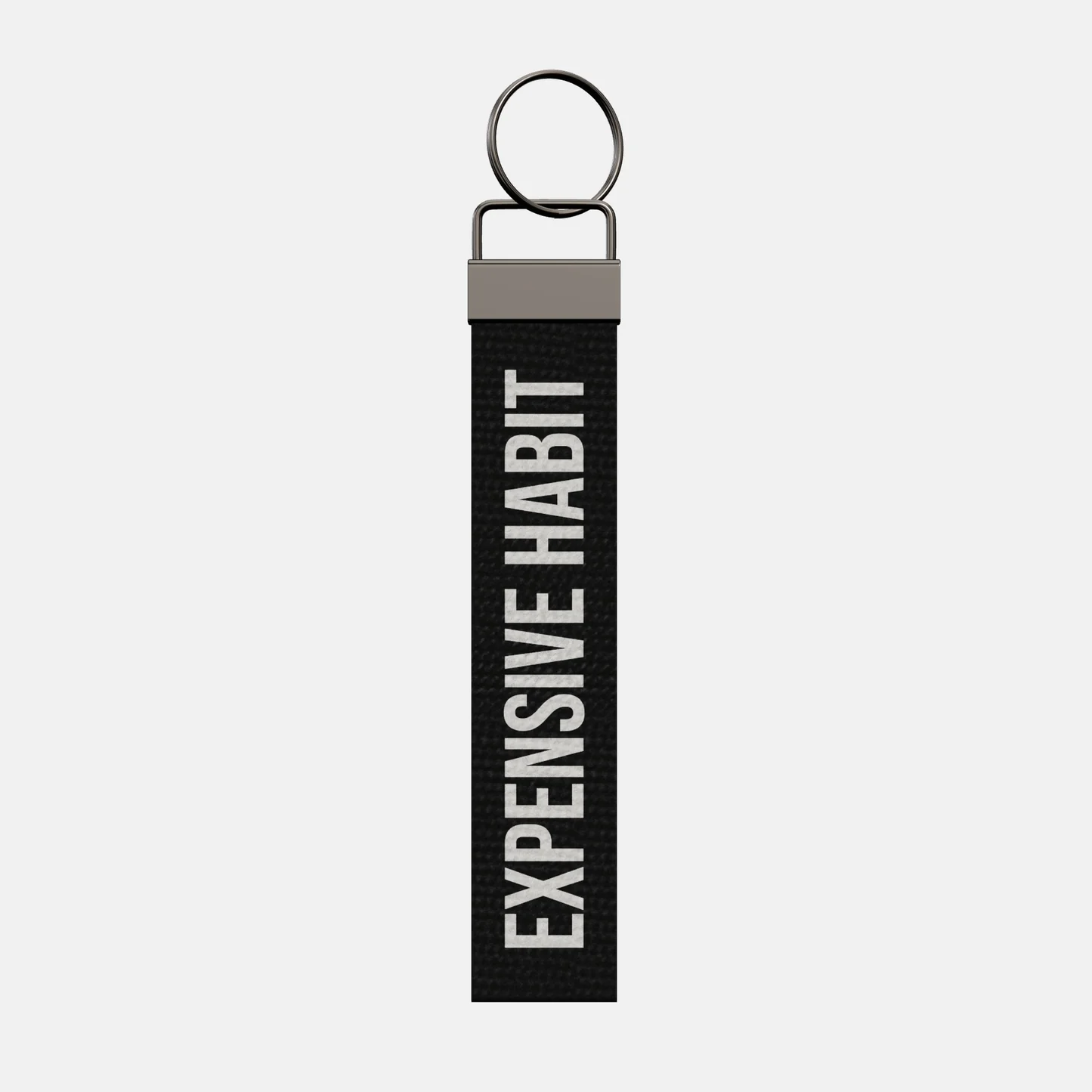 EXPENSIVE HABIT Keychain, front: EXPENSIVE HABIT in white print