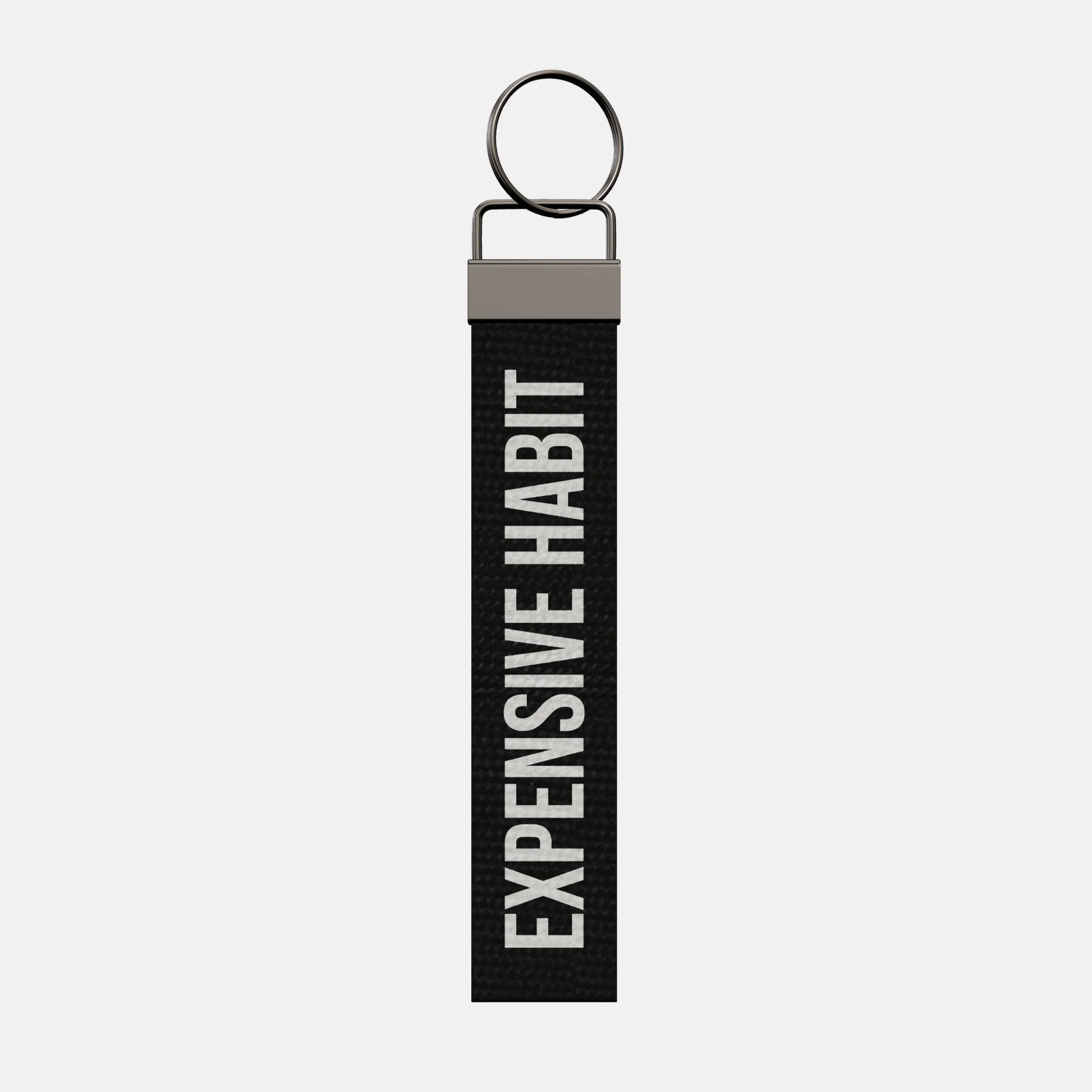 EXPENSIVE HABIT Keychain, front: EXPENSIVE HABIT in white print