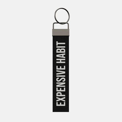 EXPENSIVE HABIT Keychain, front: EXPENSIVE HABIT in white print