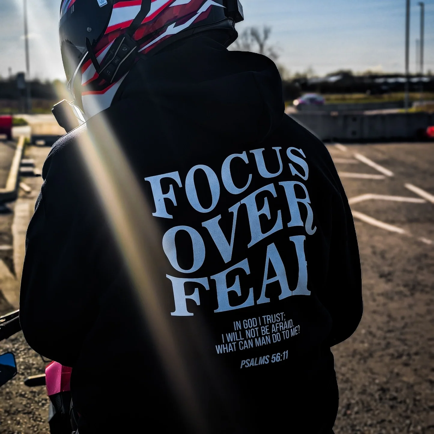 Rider wearing the FOCUS OVER FEAR Hoodie, back print