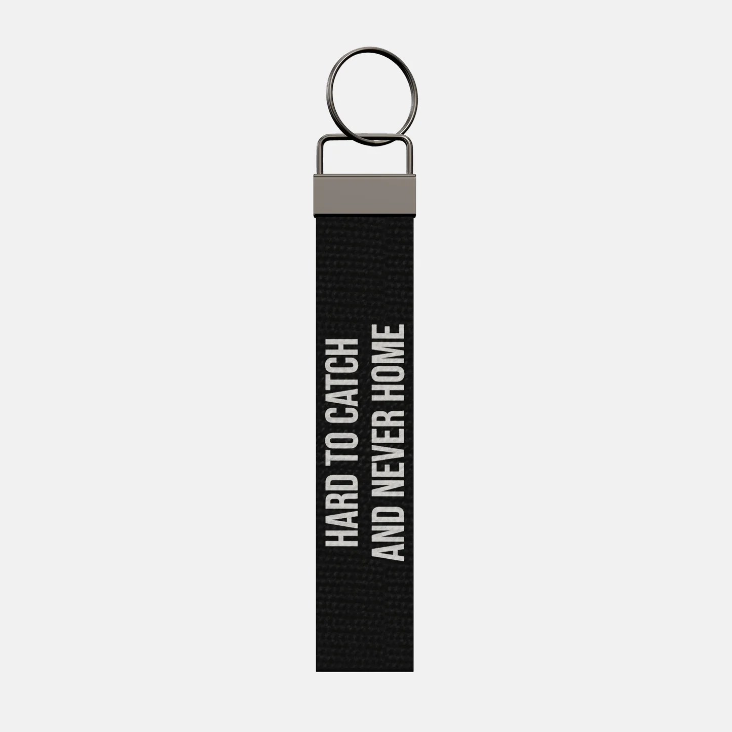 HARD TO CATCH AND NEVER HOME Keychain, front: HARD TO CATCH AND NEVER HOME in white print