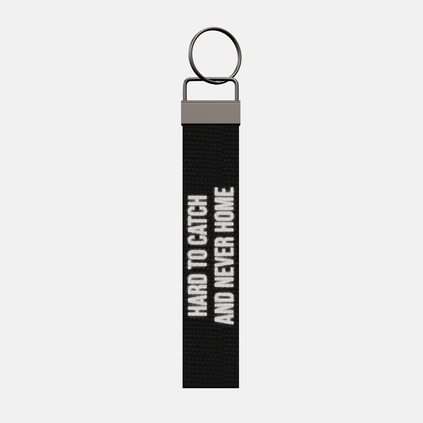 HARD TO CATCH AND NEVER HOME Keychain, front: HARD TO CATCH AND NEVER HOME in reflective print