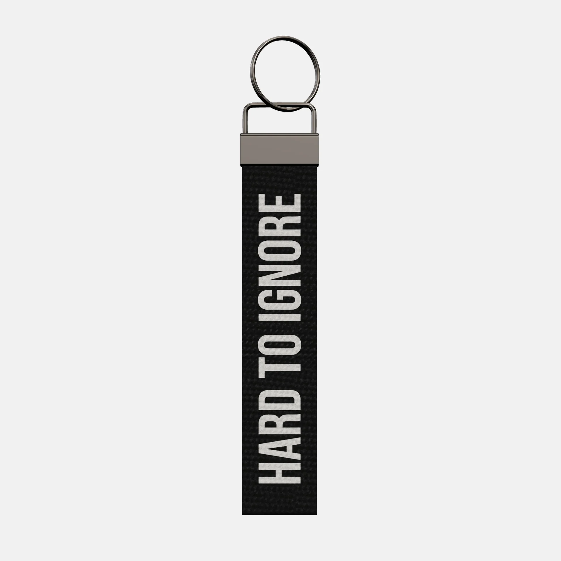 HARD TO IGNORE Keychain, front: HARD TO IGNORE in white print