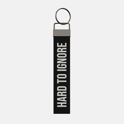 HARD TO IGNORE Keychain, front: HARD TO IGNORE in white print