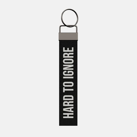 HARD TO IGNORE Keychain, front: HARD TO IGNORE in white print