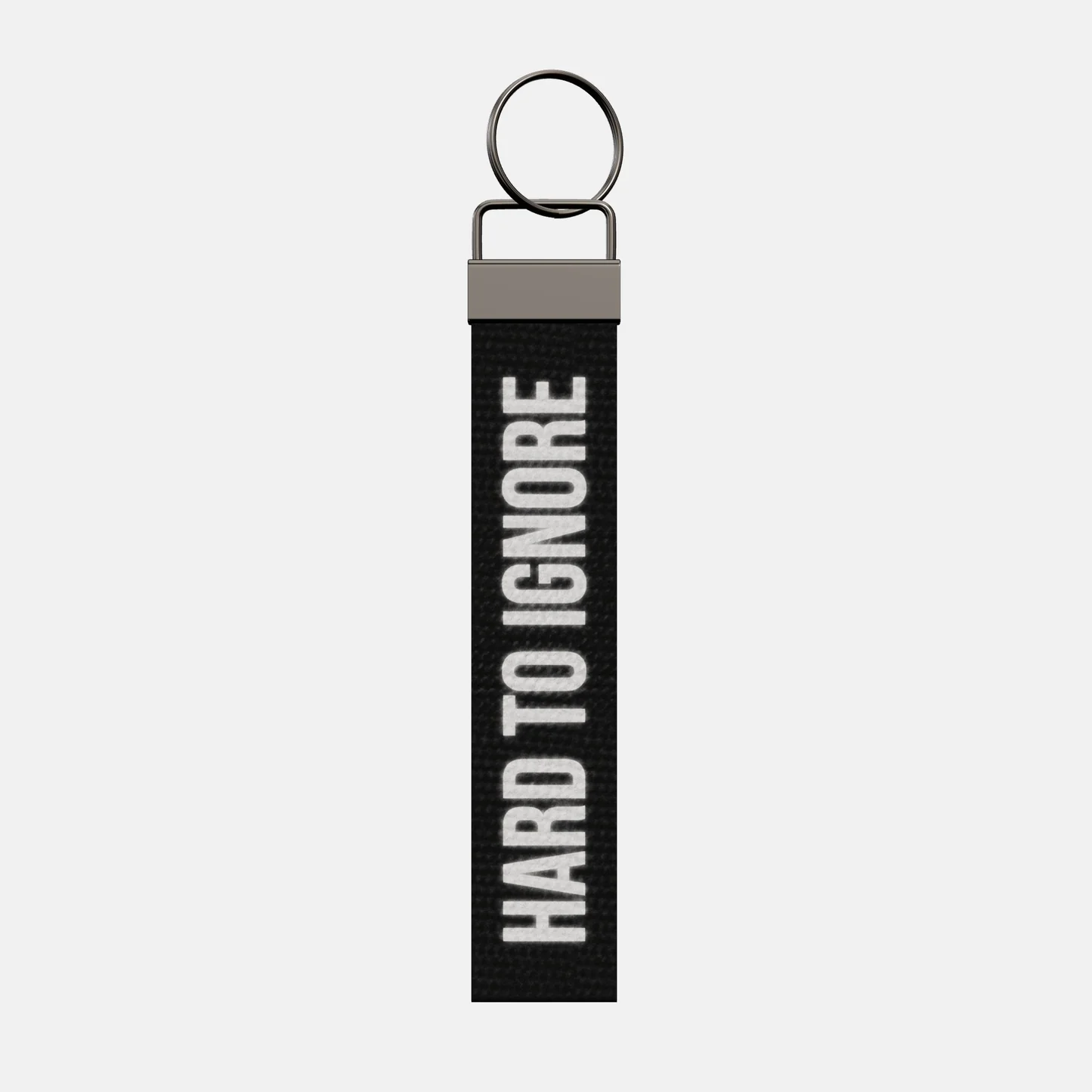 HARD TO IGNORE Keychain, front: HARD TO IGNORE in reflective print
