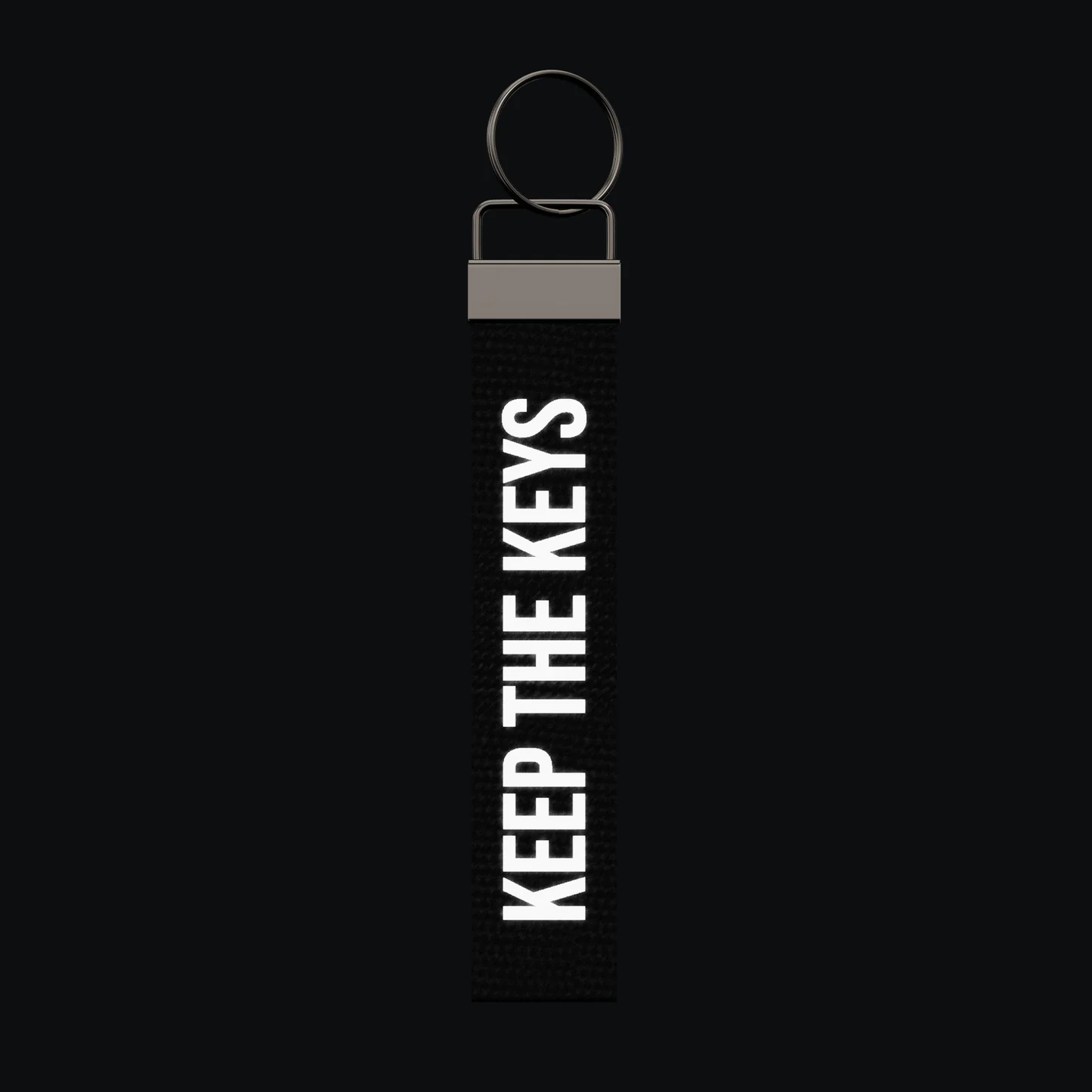 KEEP THE KEYS Keychain, reflective print lit up by a camera flash