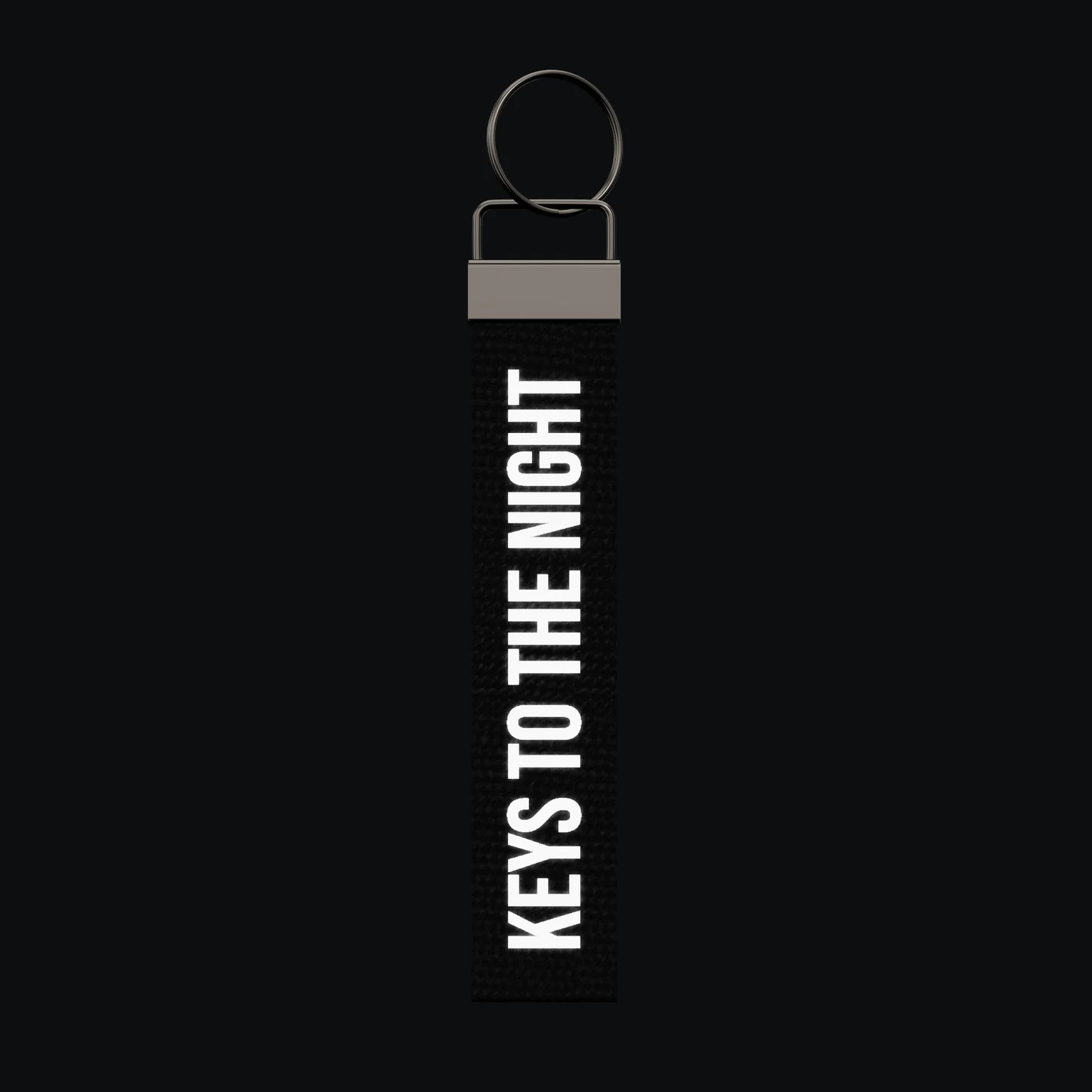 KEYS TO THE NIGHT Keychain, reflective print lit up by a camera flash
