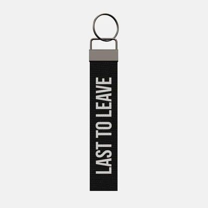 LAST TO LEAVE Keychain, front: LAST TO LEAVE in white print
