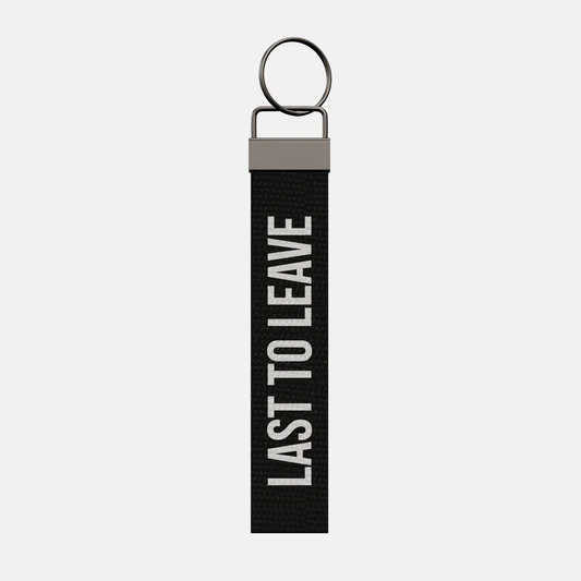 LAST TO LEAVE Keychain, front: LAST TO LEAVE in white print