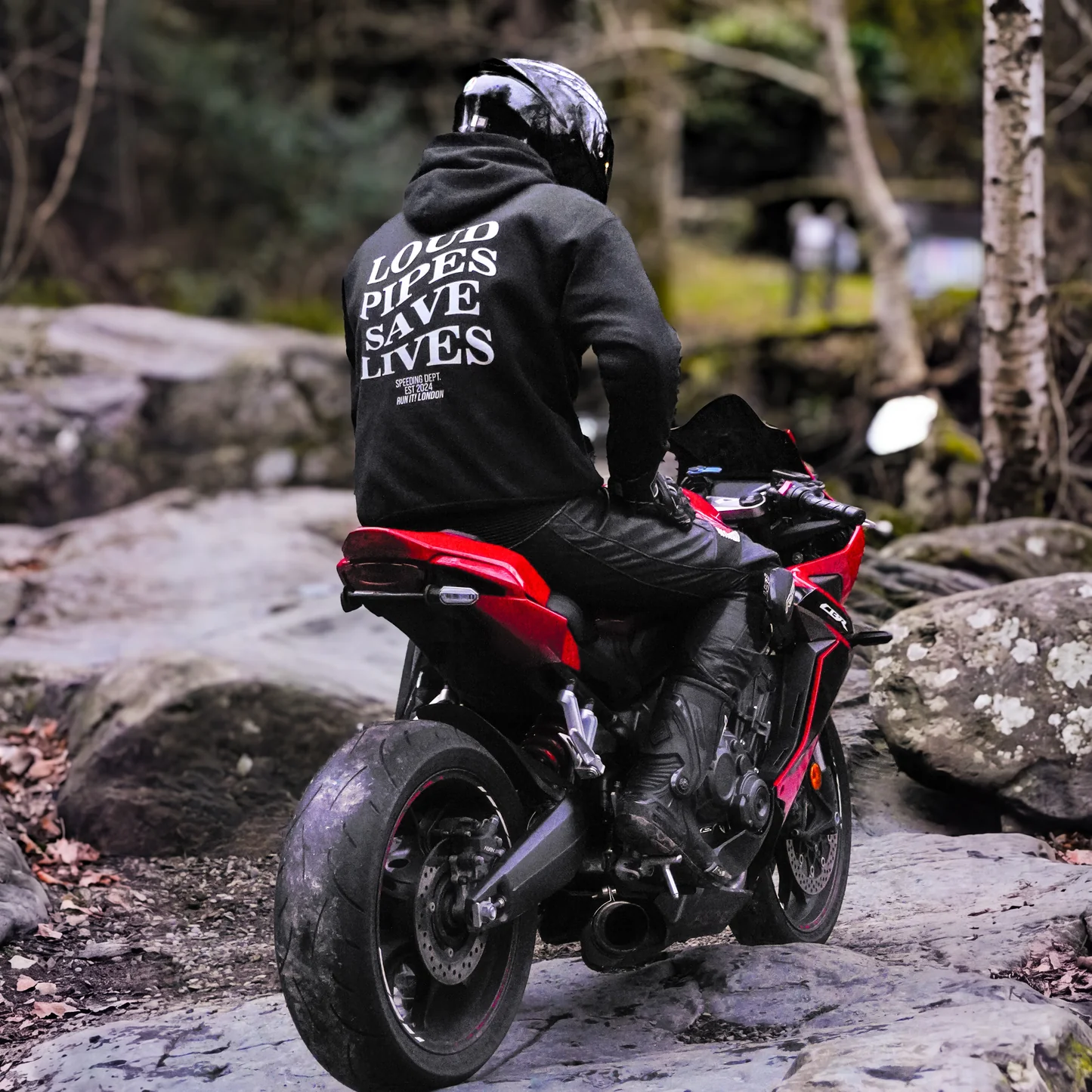 Rider wearing the LOUD PIPES SAVE LIVES Hoodie, back print