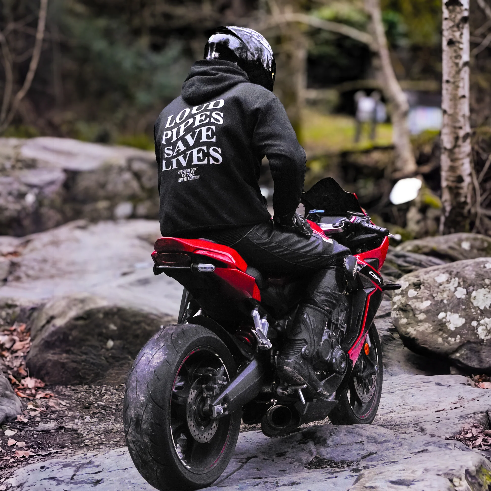 Rider wearing the LOUD PIPES SAVE LIVES Hoodie, back print