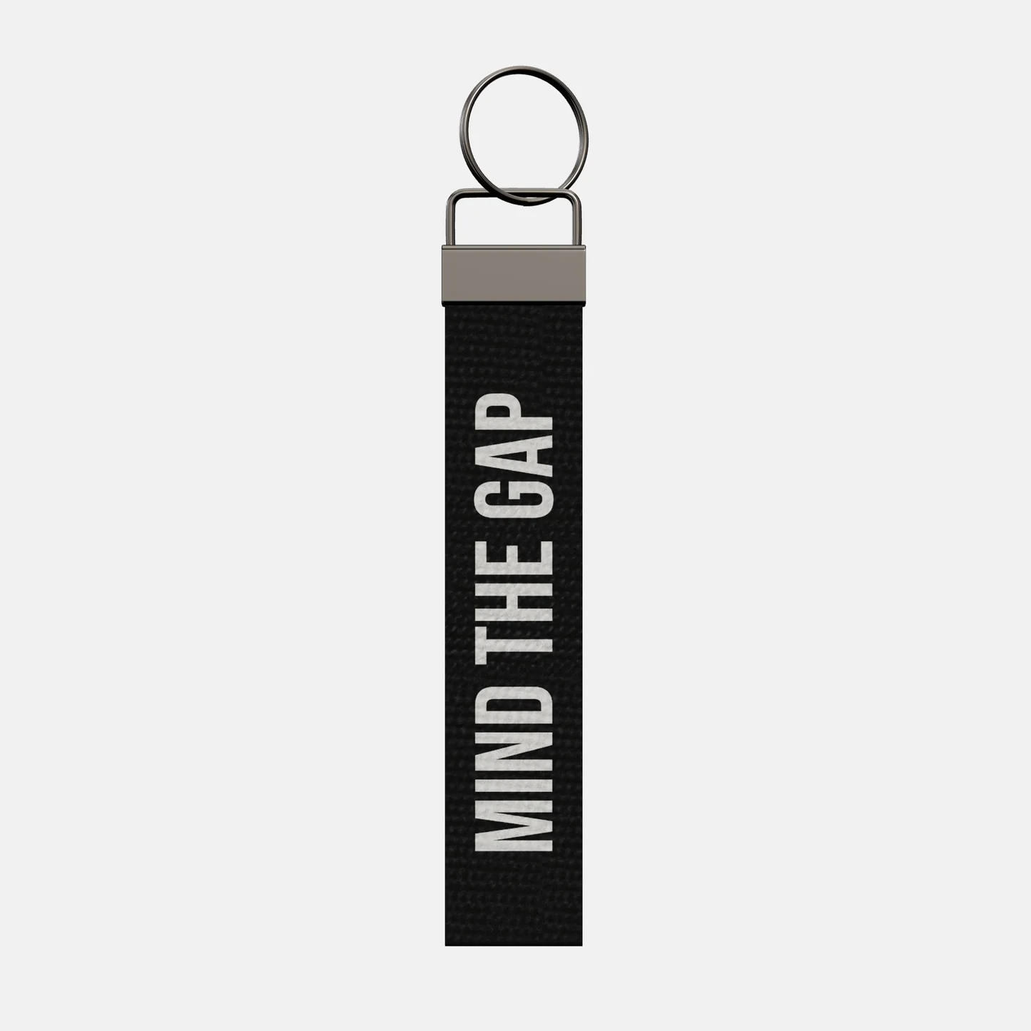 MIND THE GAP Keychain, front: MIND THE GAP in white print