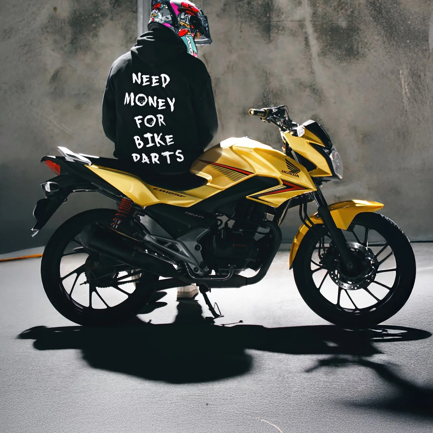 Rider wearing the NEED MONEY FOR BIKE PARTS Hoodie, back print