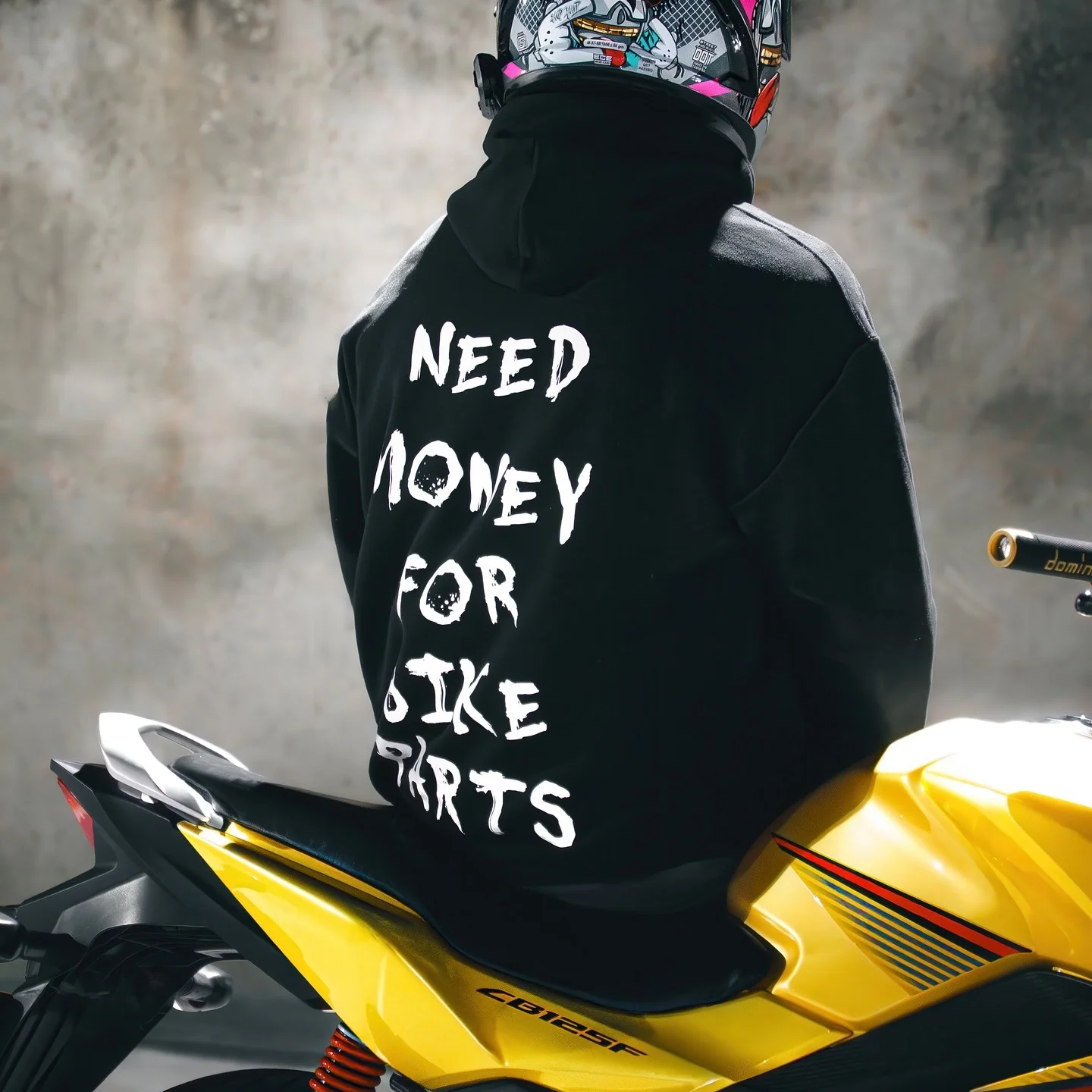 Rider wearing the NEED MONEY FOR BIKE PARTS Hoodie, back print
