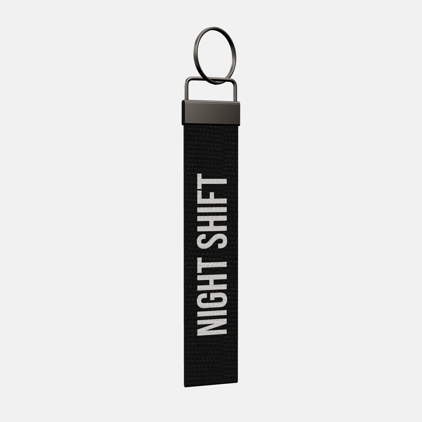 NIGHT SHIFT Keychain at an angle, black-nickel clamp and split ring
