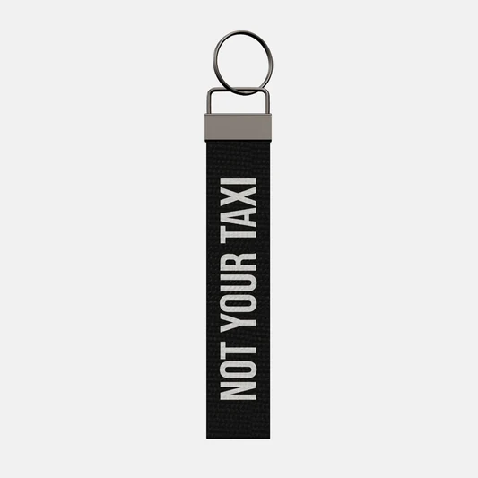NOT YOUR TAXI Keychain, front: NOT YOUR TAXI in white print
