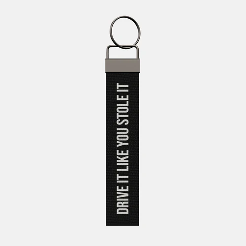 Personalised Keychain, front: DRIVE IT LIKE YOU STOLE IT in white print