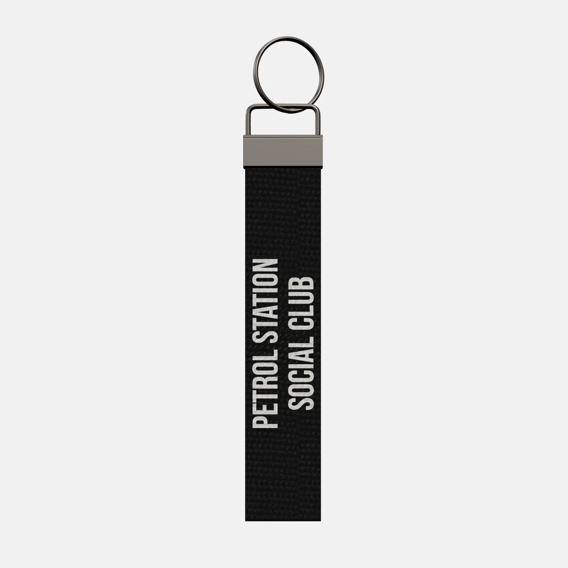 PETROL STATION SOCIAL CLUB Keychain, front: PETROL STATION SOCIAL CLUB in white print