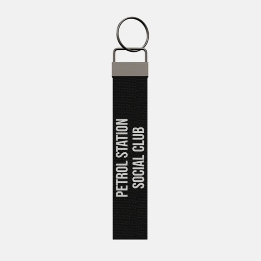 PETROL STATION SOCIAL CLUB Keychain, front: PETROL STATION SOCIAL CLUB in white print