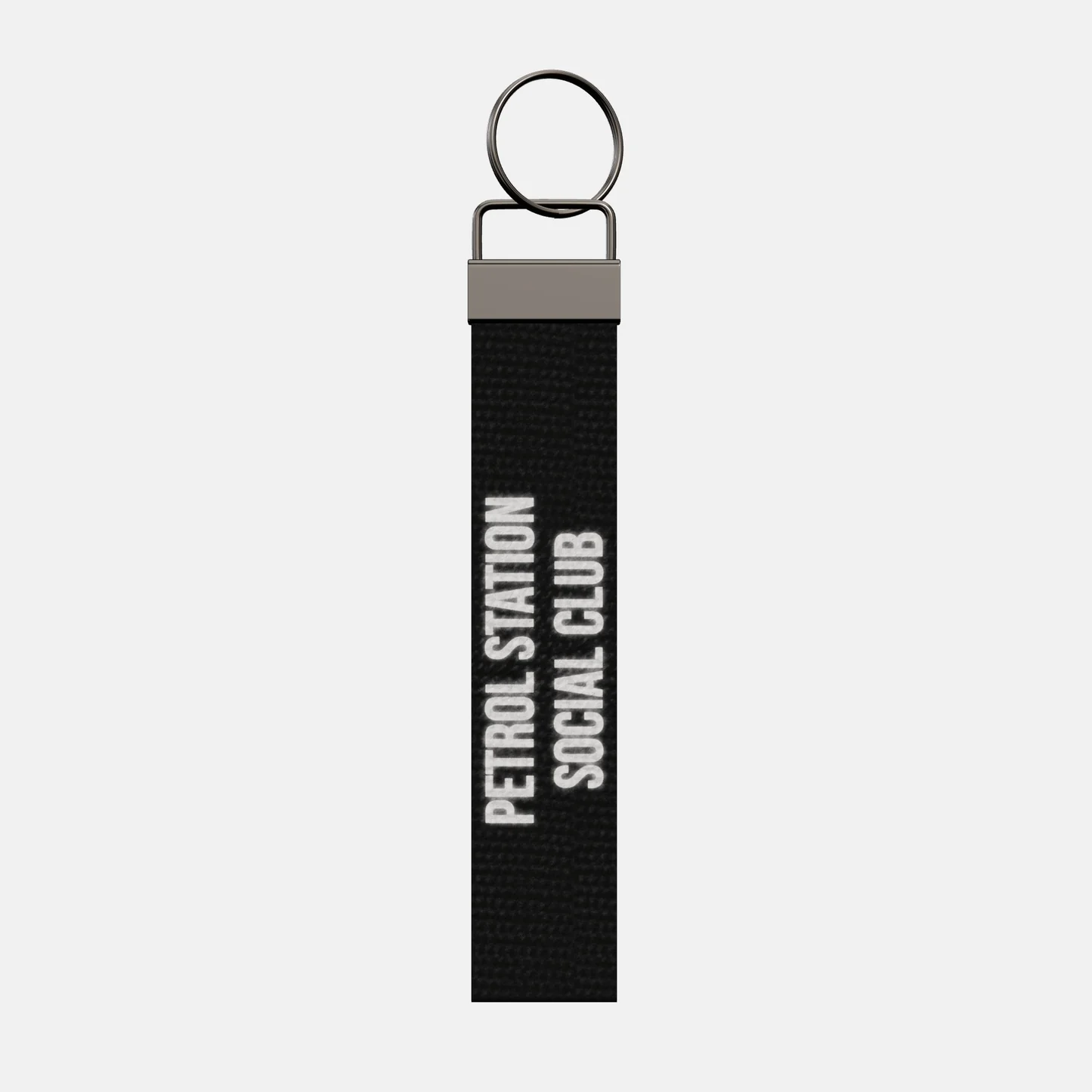 PETROL STATION SOCIAL CLUB Keychain, front: PETROL STATION SOCIAL CLUB in reflective print