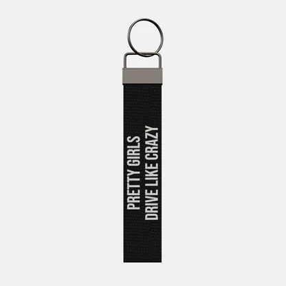 PRETTY GIRLS DRIVE LIKE CRAZY Keychain, front: PRETTY GIRLS DRIVE LIKE CRAZY in white print