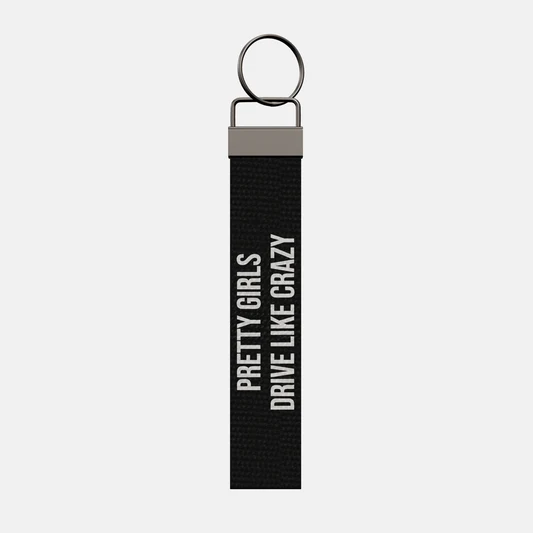 PRETTY GIRLS DRIVE LIKE CRAZY Keychain, front: PRETTY GIRLS DRIVE LIKE CRAZY in white print