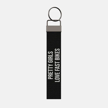 PRETTY GIRLS LOVE FAST BIKES Keychain, front: PRETTY GIRLS LOVE FAST BIKES in white print