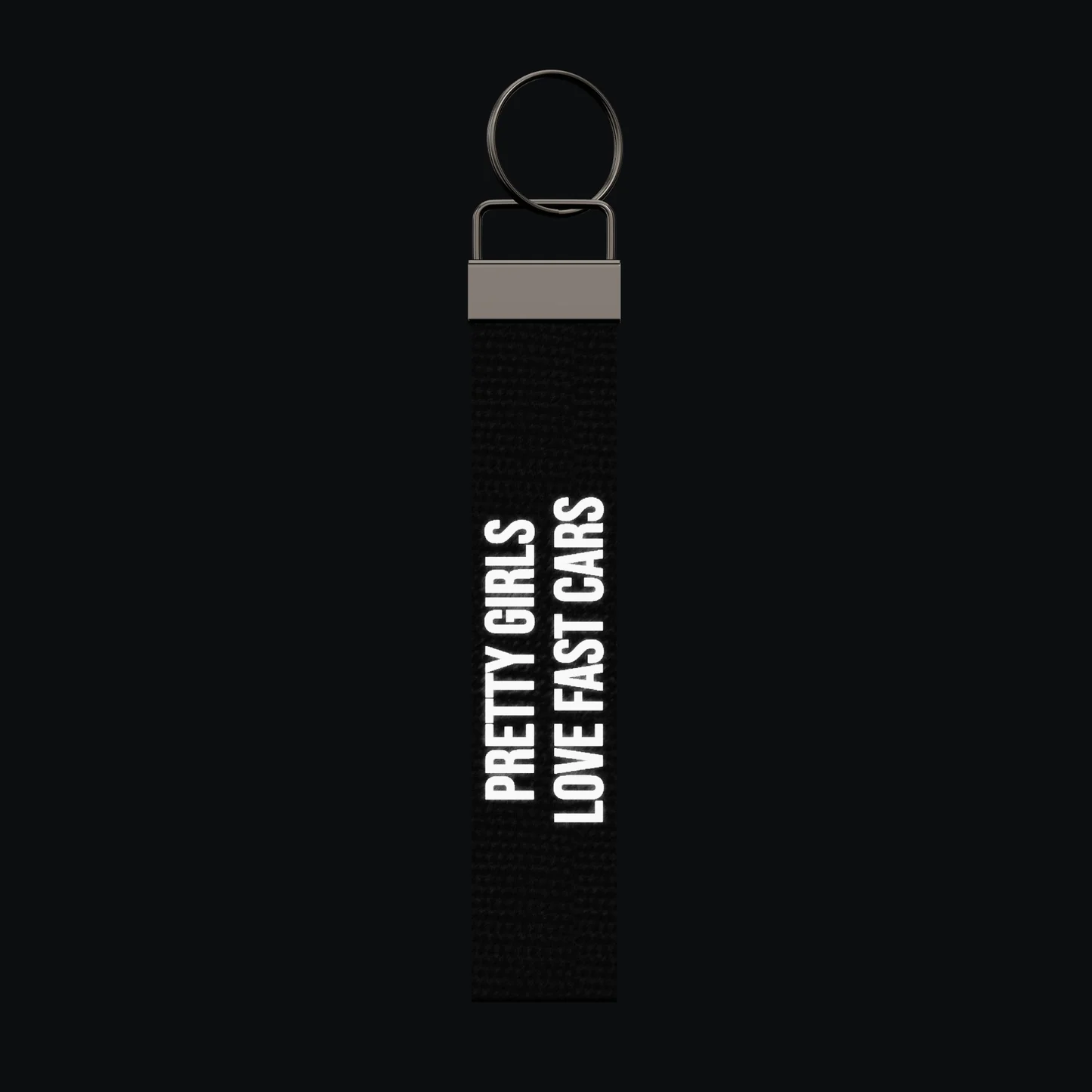 PRETTY GIRLS LOVE FAST CARS Keychain, reflective print lit up by a camera flash