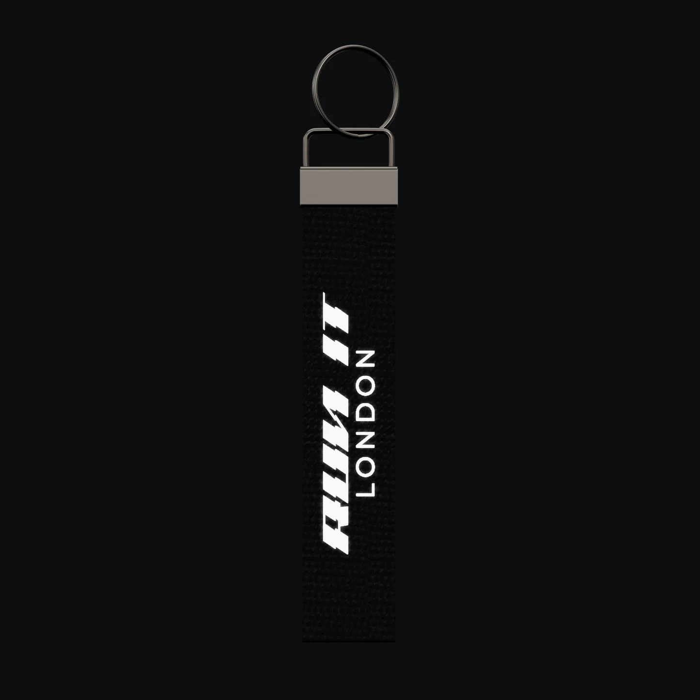 RUN IT LONDON Keychain, reflective print lit up by a camera flash