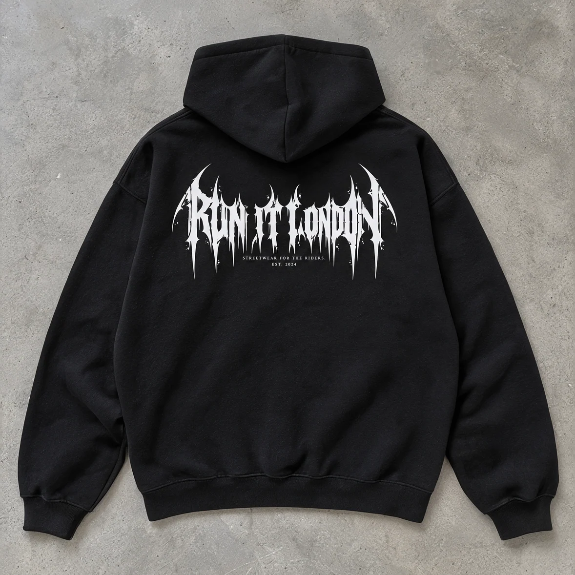 CYBERSIGIL Hoodie — black hoodie back print laid flat on concrete floor