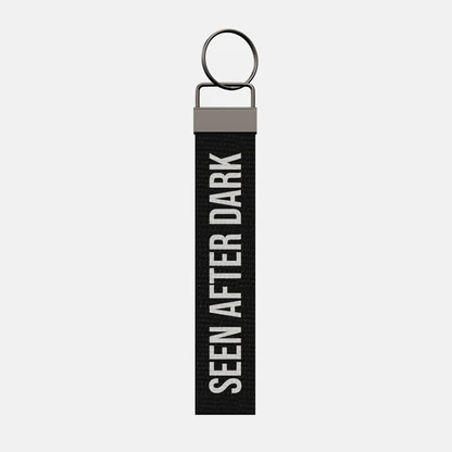 SEEN AFTER DARK Keychain, front: SEEN AFTER DARK in white print