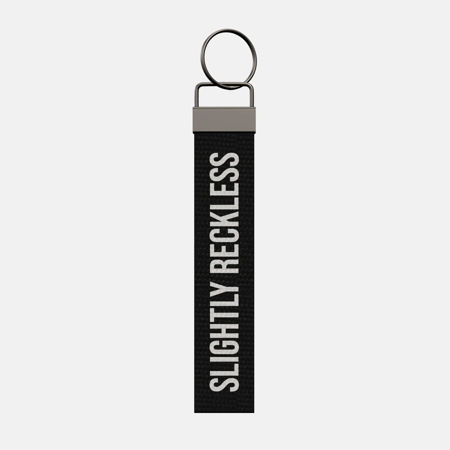 SLIGHTLY RECKLESS Keychain, front: SLIGHTLY RECKLESS in white print