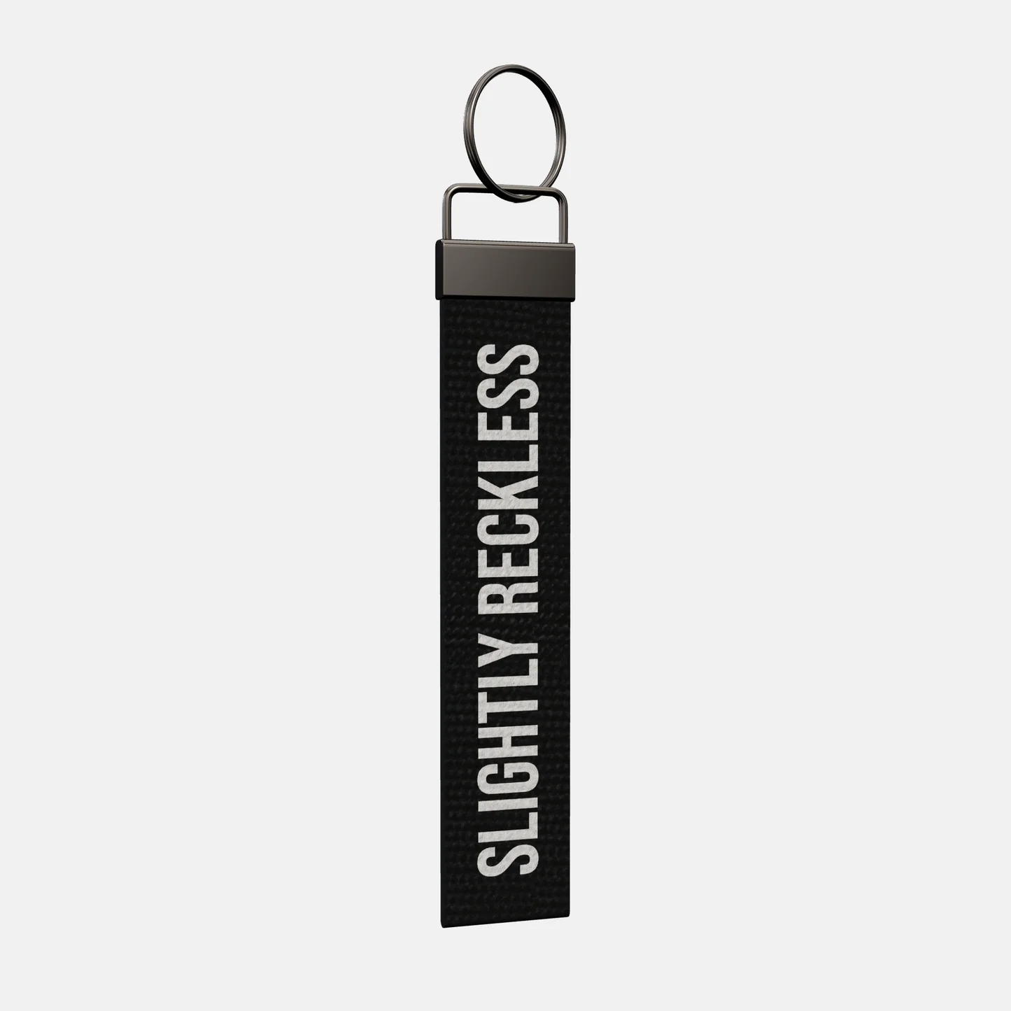 SLIGHTLY RECKLESS Keychain at an angle, black-nickel clamp and split ring