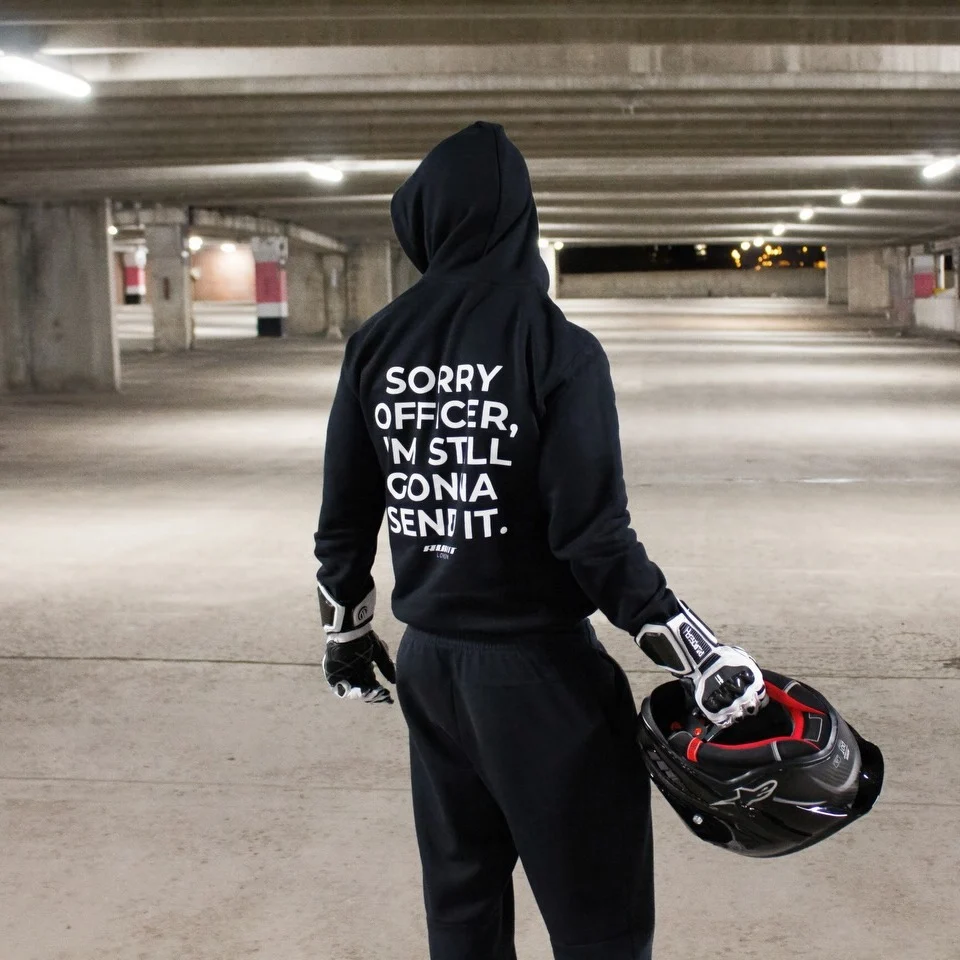 Rider wearing the SORRY OFFICER, I'M STILL GONNA SEND IT Hoodie, back print