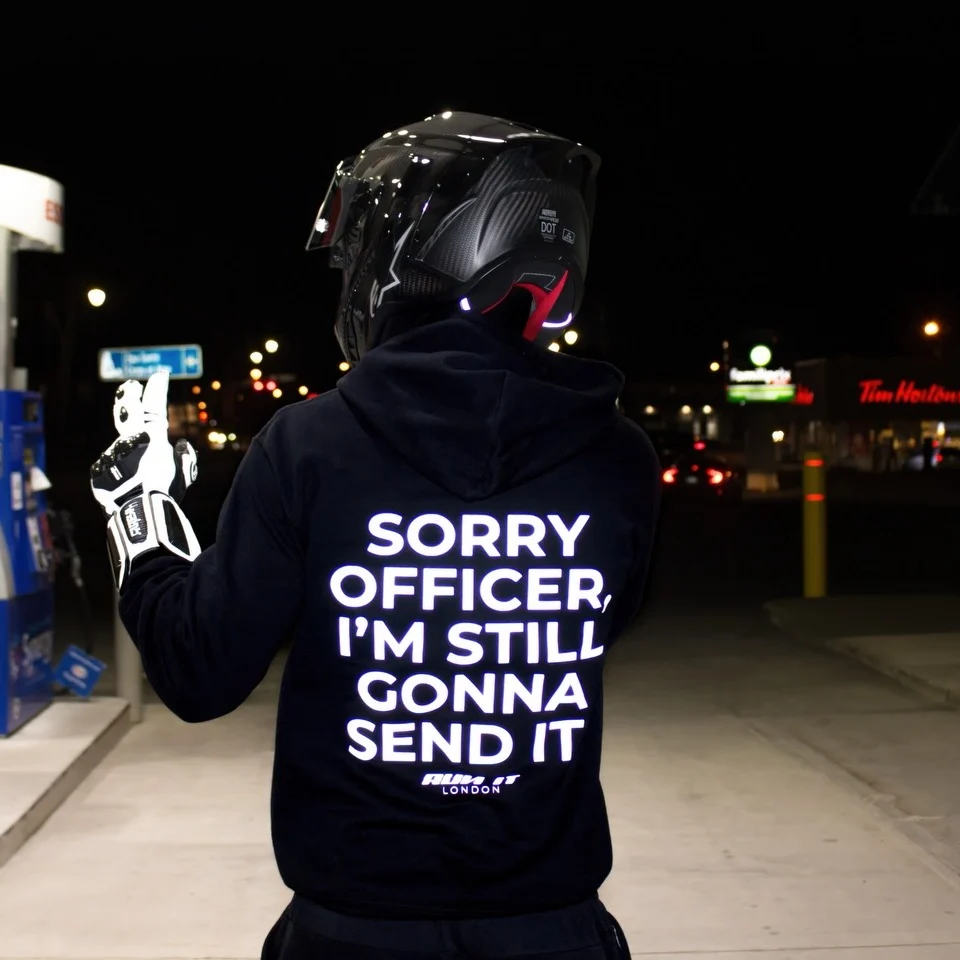 Rider wearing the SORRY OFFICER, I'M STILL GONNA SEND IT Hoodie, back print