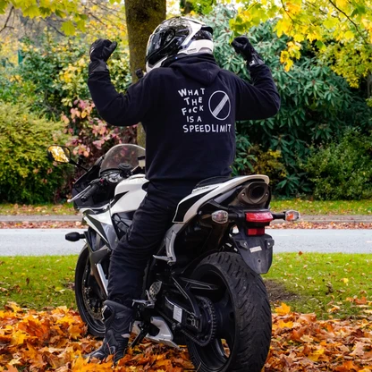 Rider wearing the WHAT THE F#CK IS A SPEEDLIMIT Hoodie, back print
