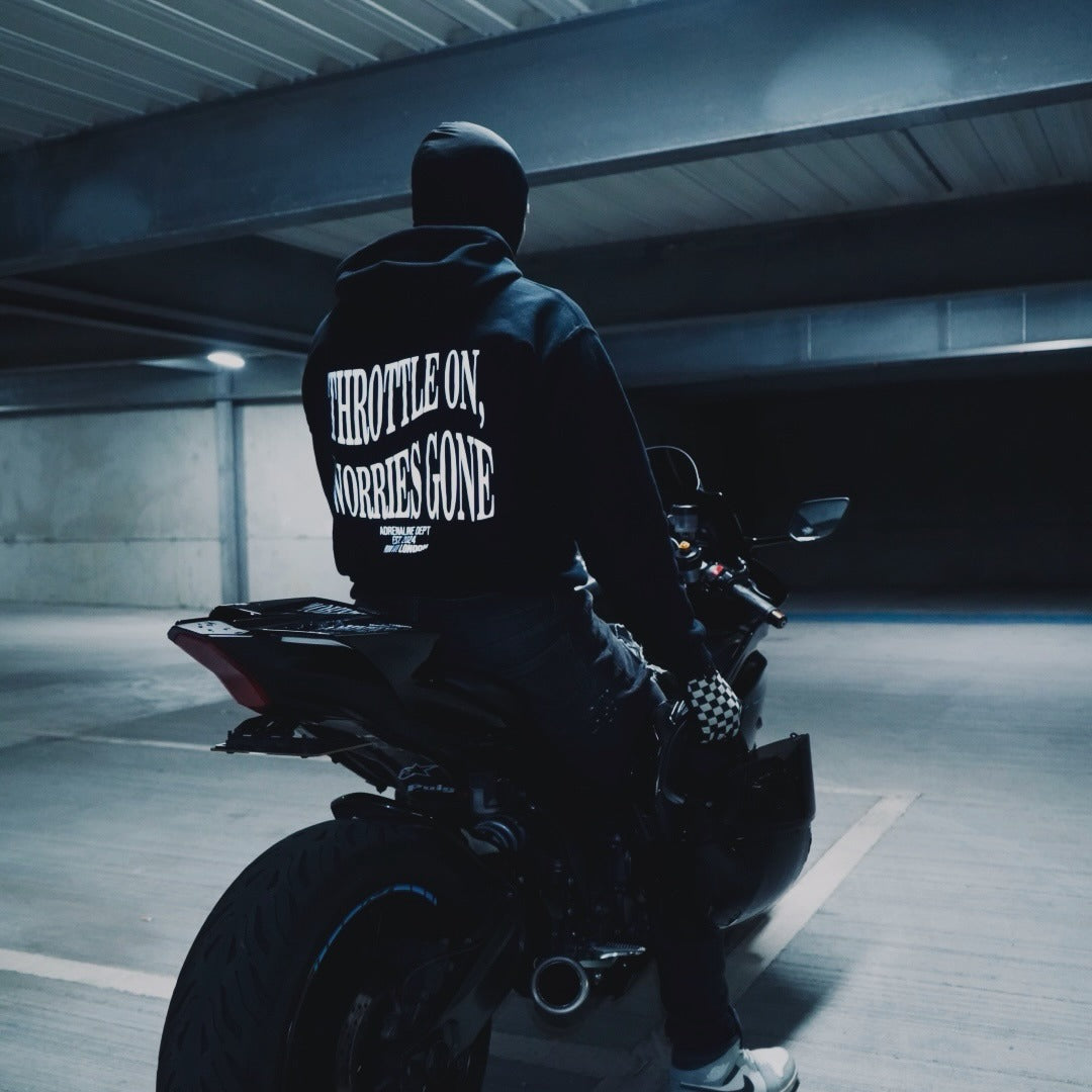 Rider wearing the THROTTLE ON, WORRIES GONE Hoodie, back print